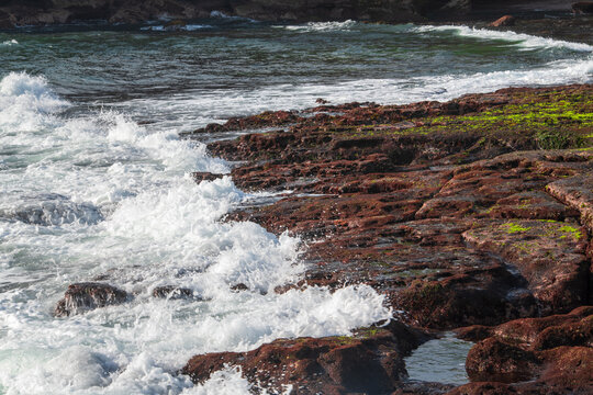 waves crashing on rocks