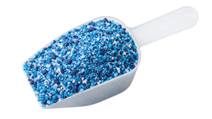 A white plastic scoop filled with vibrant blue granular material, such as fertilizer or pool chemicals, isolated on transparent background