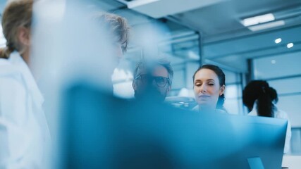 Group of focused professionals collaborating on a project in a modern office environment, analyzing data on a computer screen. Teamwork and innovation drive their creative process - Powered by Adobe
