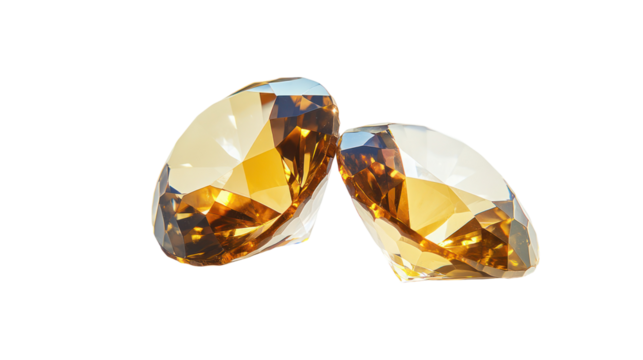 Two faceted yellow gemstones isolated on transparent background