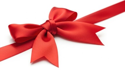 Fototapeta premium Close up of a vibrant red satin gift ribbon tied into a perfect bow, isolated on white background for celebration and present concept