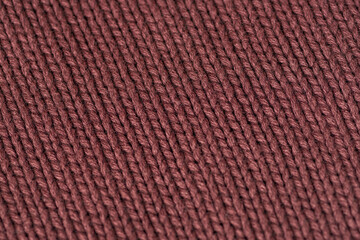 Brown knitted fabric texture, closeup