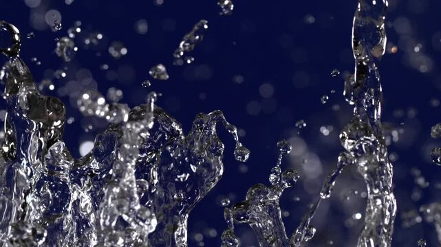 Close-up of water splashes creating beautiful patterns in a dark blue background
