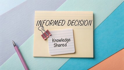 Inspirational note about informed decision making and shared knowledge on colorful background with stationery items