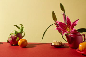 Festive setup with Lunar New Year fruits, floral elements, and warm background tones. Blank space for lifestyle branding, seasonal marketing, greeting cards, and cultural campaign visuals.