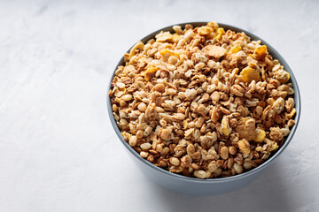 Bowl of Dry Granola Cereal on Gray Background Nutritious Snack Copy Space