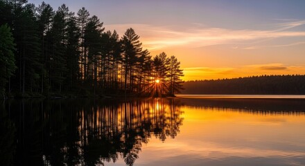 Fototapeta premium Golden hour at the lake: Captivating sunset casting a warm glow on tranquil waters and forest line