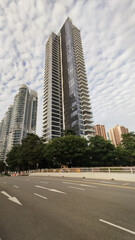 twin towers in a fluffy sky background