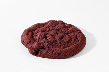 Chunky double chocolate chip cookie on white. 
