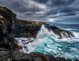 Dramatic Ocean Wave Crashing Against Rocky Coastline Under Stormy Sky  Coastal Landscape Photography