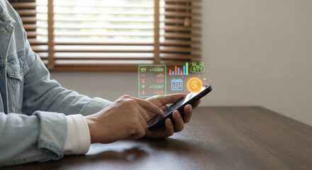 Person using a smartphone with financial data projected on the screen, analyzing investments.