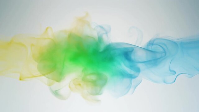 The Gentle Collision. Abstract Background of Rainbow. The moment two soft waves of colorful smoke gently collide. One wave is a translucent yellow and the other is a translucent blue.
