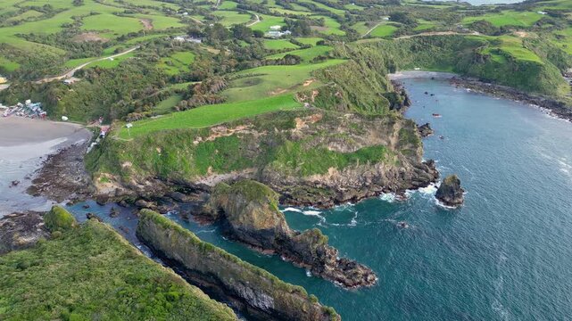 Chiloe Island, Chile: Aerial downward drone footage orbiting cliffs by pacific ocean in Pu&ntilde;ihuil of Ancud in Chiloe island, Lake District of Chile. Shot with an oribt motion