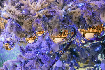 Silver  Christmas balls, Crystal balls are decorated on a purple and silver Christmas tree, Christmas tree decoration idea and indoor lights to welcome the happy holiday season of New Year 2026.