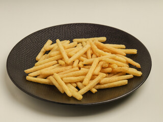 Potato stick crunchy snacks isolated on white background 