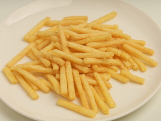 Potato stick crunchy snacks isolated on white background 