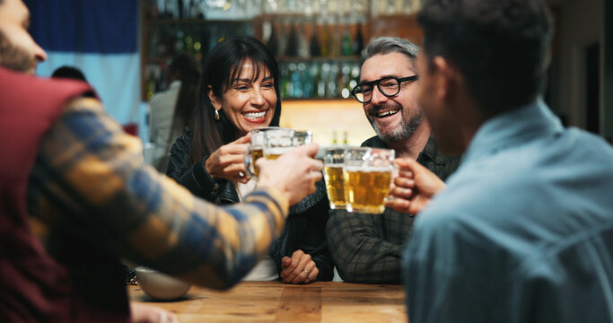 People, excited and toast beer at bar, celebration or announcement with party, happy hour and drinks. Friends, glasses and cheers at pub with alcohol, success or social gathering for new years eve