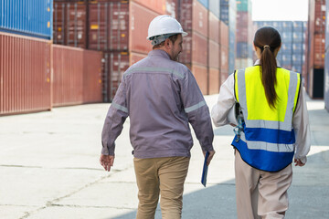 Logistics workers walking at cargo container yard, Industrial team inspecting shipping containers outdoors, Warehouse staff coordinating operations at freight terminal