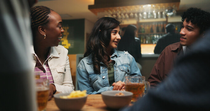Conversation, friends and people in pub, alcohol and bonding together with reunion. Group, men and woman in restaurant, discussion and celebration with beer, humor and social gathering with happiness