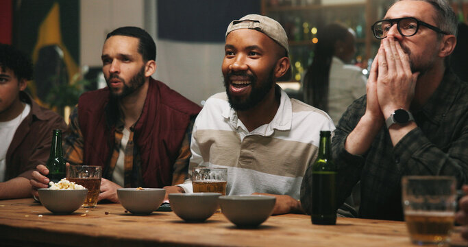 Men, friends and nervous at sports bar, watching tv and global competition with drinks at night club. People, anxiety and live streaming for international football game, contest and beer at pub