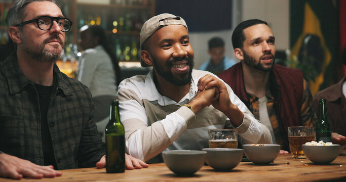 Stress, watching tv and men in pub for sports game with championship for entertainment together. Anxiety, live streaming and group of male friends with football match in bar for online tournament. - Powered by Adobe