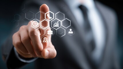 Businessman in suit uses finger to interact with hexagonal grid icons (phone, clock, chart, briefcase, location, profile); representing integrated business management, multi-module collaboration