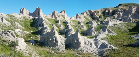 Badlands landscape with eroded rock formations and dramatic terrain