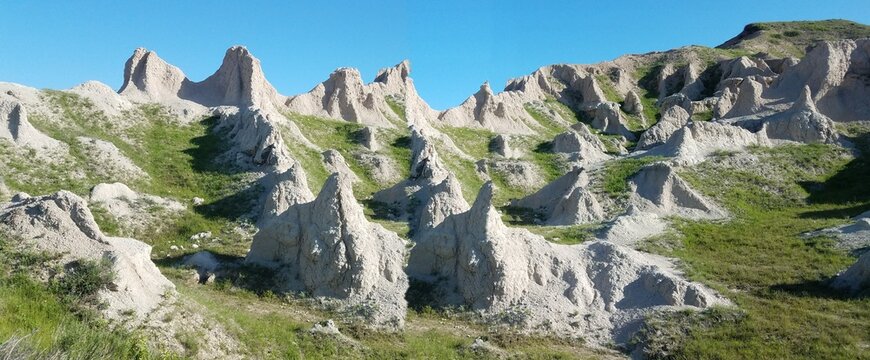 Badlands landscape with eroded rock formations and dramatic terrain - Powered by Adobe