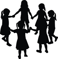 Silhouette of children holding hands in a circle playing together outdoors