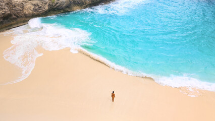 Solo Traveler On Kelingking Beach, Nusa Penida - Turquoise Surf And Cliffs