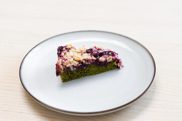 A slice of matcha cherry cake.