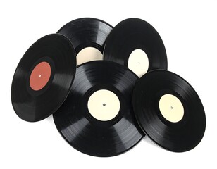 Black vinyl records scattered on a white background, some with labels visible
