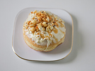 Donut with glaze toppings on white background