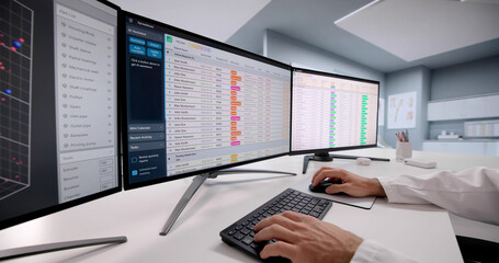 Doctor Coding Medical Bills In Hospital Using Spreadsheet
