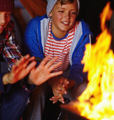 Camping, fire and night with children outdoor together for adventure, bonding or survival hobby....