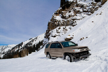 Off-Road SUV Buried in Deep Mountain Snow During Winter Expedition