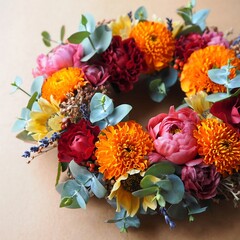 Obraz premium Vibrant floral wreath with sunflowers roses eucalyptus and other colorful blooms