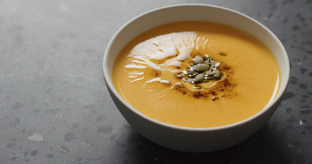 pumpkin soup with seeds closeup