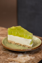 Shine Muscat grape jelly, on top of cheesecake with crumble base served on plate