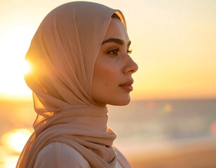 Woman in hijab at sunrise, profile view, warm tones