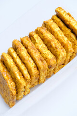 Tempeh yellow spices in plastic containers for stock in refrigerator