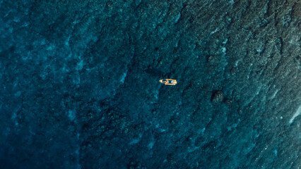 Kayaking in blue ocean. Aerial view