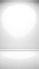 An empty white room with a soft spotlight creating a bright focal point on the wall and floor.