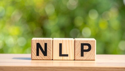 Three wooden blocks on white surface, each printed with a black letter—“N”, “L”, “P”—against blurred green-yellow background, symbolizing Natural Language Processing in tactile, minimalist form.
