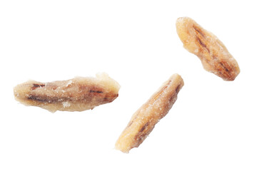 Three date pits isolated on a white background. Close-up.