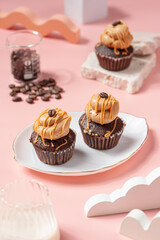 A Cupcake is a small, single-serving cake baked in a small cup-shaped mold, often lined with paper