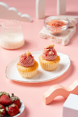 A Cupcake is a small, single-serving cake baked in a small cup-shaped mold, often lined with paper