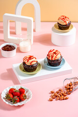 A Cupcake is a small, single-serving cake baked in a small cup-shaped mold, often lined with paper