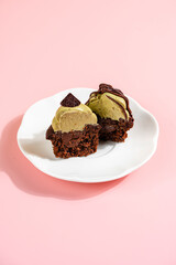 A Cupcake is a small, single-serving cake baked in a small cup-shaped mold, often lined with paper