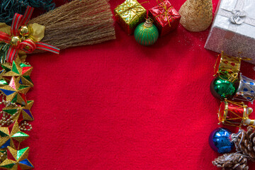 Merry Christmas concept on red background. New Year decorations. Top view of Noel ornaments. 